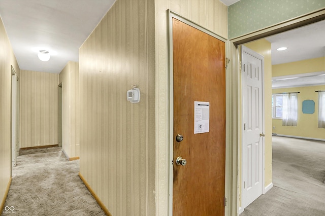 3215 E Edgewood Ave, Indianapolis, IN 46227 - corridor featuring carpet, wallpapered walls, and baseboards