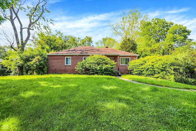 3215 E Edgewood Ave, Indianapolis, IN 46227 - view of front of home featuring brick siding, a chimney, and a front yard