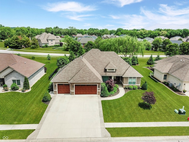 3335 Guilford Ln, Plainfield, IN 46168 - view of front of property with brick siding, an attached garage, concrete driveway, a residential view, and a front yard
