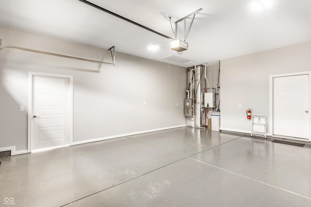 3335 Guilford Ln, Plainfield, IN 46168 - garage featuring a garage door opener, baseboards, and water heater