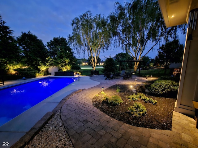 3335 Guilford Ln, Plainfield, IN 46168 - pool at dusk with a patio area