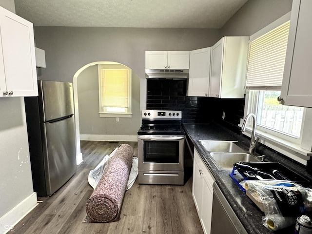 4814 E New York St, Indianapolis, IN 46201 - kitchen with appliances with stainless steel finishes, a sink, white cabinets, and under cabinet range hood