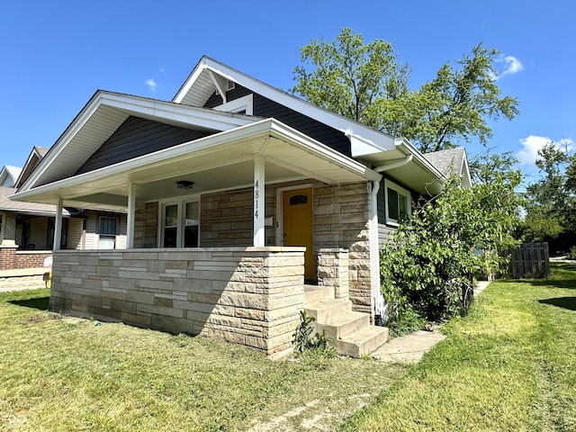 4814 E New York St, Indianapolis, IN 46201 - view of front of property with stone siding and covered porch