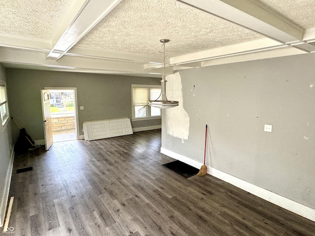 4814 E New York St, Indianapolis, IN 46201 - unfurnished dining area with a textured ceiling, healthy amount of natural light, baseboards, dark wood-type flooring, and beam ceiling