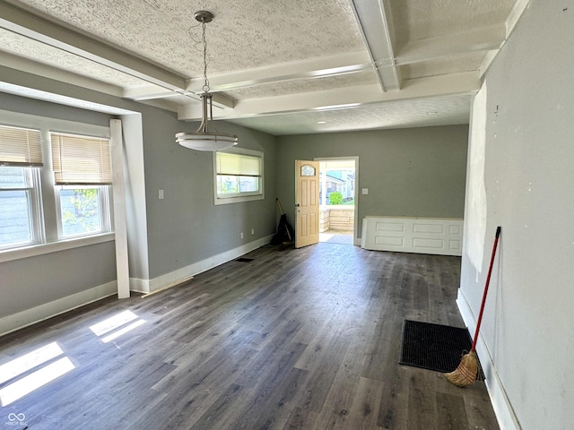 4814 E New York St, Indianapolis, IN 46201 - unfurnished dining area with dark wood-style floors, beam ceiling, and baseboards