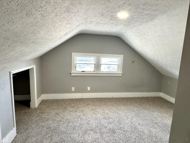 4814 E New York St, Indianapolis, IN 46201 - bonus room with carpet, lofted ceiling, a textured ceiling, and baseboards