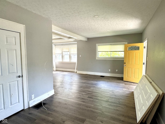 4814 E New York St, Indianapolis, IN 46201 - spare room with a textured ceiling, baseboards, and wood finished floors