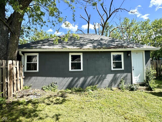 4814 E New York St, Indianapolis, IN 46201 - view of side of home with concrete block siding and roof with shingles