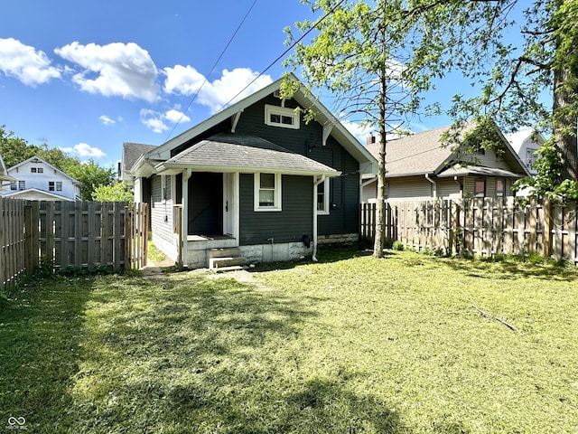 4814 E New York St, Indianapolis, IN 46201 - rear view of house featuring roof with shingles