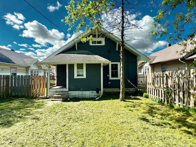 4814 E New York St, Indianapolis, IN 46201 - back of house with a fenced backyard