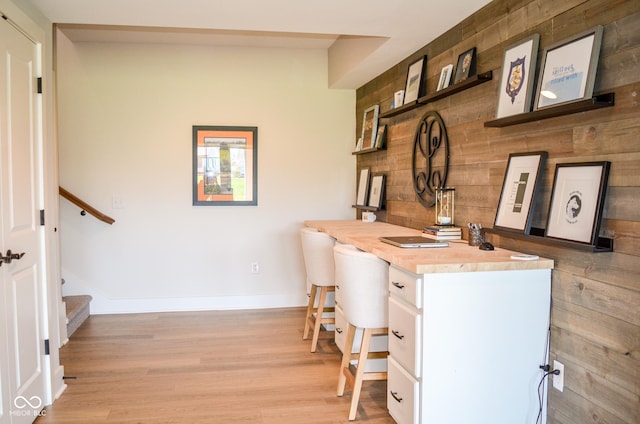 987 Oak Terrace Rd, Westfield, IN 46074 - home office with wooden walls, light wood-style floors, and baseboards