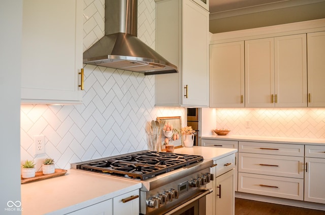 987 Oak Terrace Rd, Westfield, IN 46074 - kitchen featuring wall chimney range hood, stainless steel range, tasteful backsplash, and light countertops