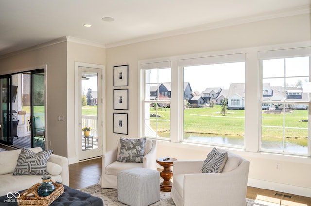 987 Oak Terrace Rd, Westfield, IN 46074 - living area featuring crown molding, plenty of natural light, wood finished floors, and baseboards