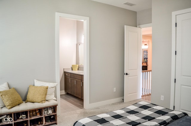 987 Oak Terrace Rd, Westfield, IN 46074 - bedroom featuring light tile patterned floors, ensuite bathroom, and baseboards