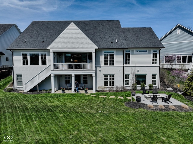 987 Oak Terrace Rd, Westfield, IN 46074 - back of property featuring a fire pit, a patio area, stairs, and a lawn
