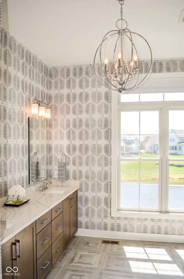 987 Oak Terrace Rd, Westfield, IN 46074 - bathroom with a chandelier and double vanity