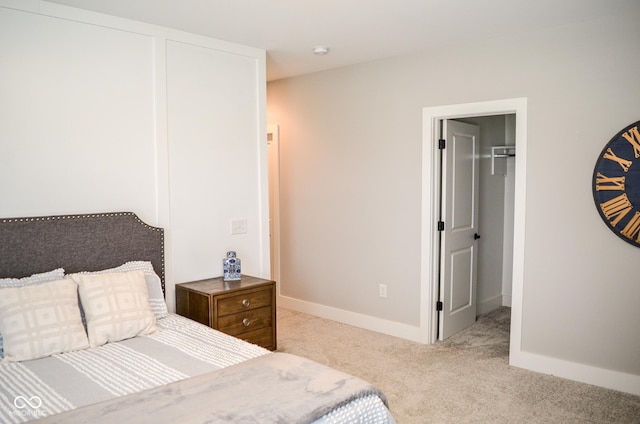 987 Oak Terrace Rd, Westfield, IN 46074 - carpeted bedroom featuring a walk in closet, baseboards, and a closet
