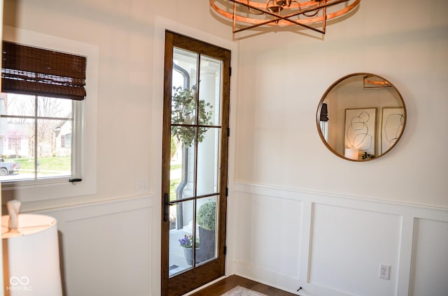 987 Oak Terrace Rd, Westfield, IN 46074 - doorway with a decorative wall, a chandelier, and a wainscoted wall