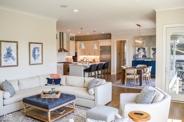 987 Oak Terrace Rd, Westfield, IN 46074 - living room featuring ornamental molding, wood finished floors, recessed lighting, and a chandelier