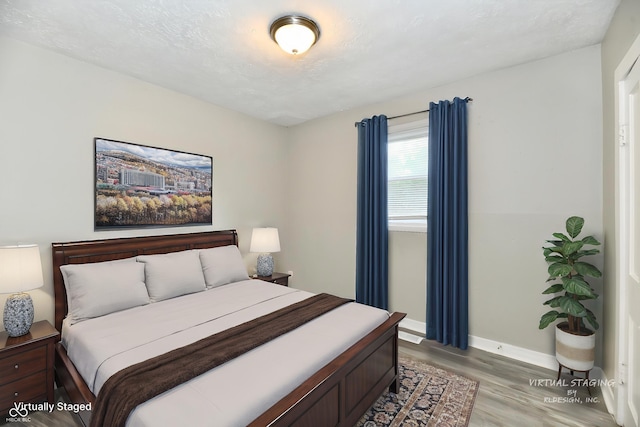 1730 N Graham Ave, Indianapolis, IN 46218 - bedroom with light wood finished floors and baseboards