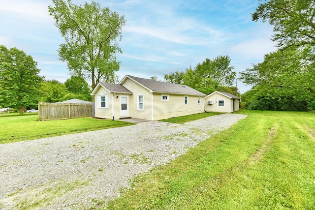 1730 N Graham Ave, Indianapolis, IN 46218 - rear view of house with gravel driveway
