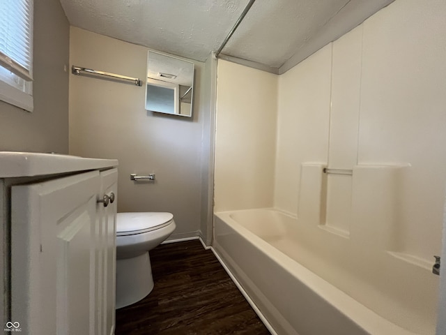 1730 N Graham Ave, Indianapolis, IN 46218 - full bathroom with wood finished floors, a textured ceiling, vanity, and bathing tub / shower combination
