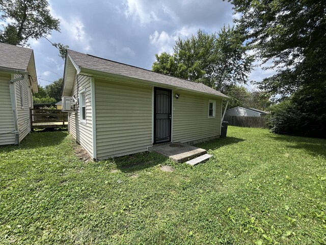 1730 N Graham Ave, Indianapolis, IN 46218 - rear view of property featuring a yard and a shingled roof