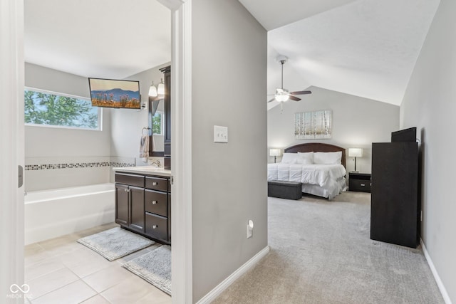 11844 Pine Meadow Cir, Fishers, IN 46037 - bedroom featuring a sink, vaulted ceiling, ceiling fan, light tile patterned floors, and baseboards