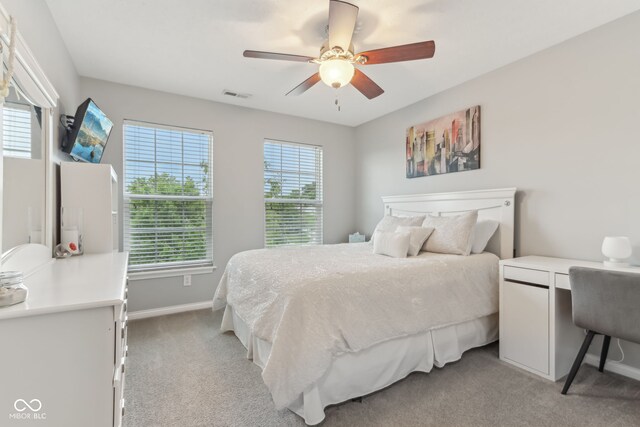 11844 Pine Meadow Cir, Fishers, IN 46037 - bedroom featuring light colored carpet, baseboards, and ceiling fan