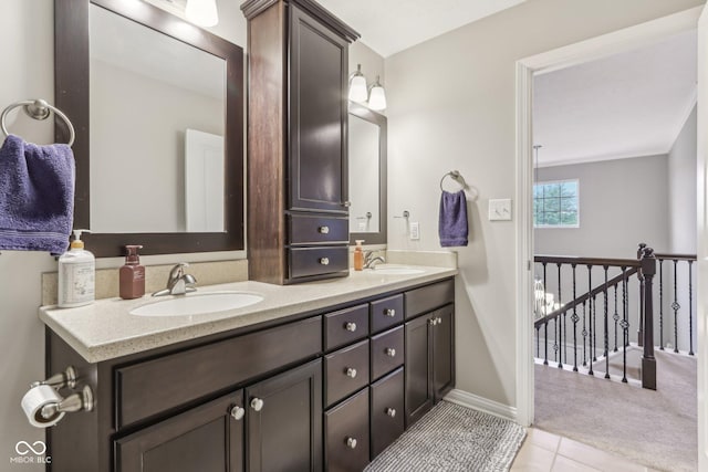 11844 Pine Meadow Cir, Fishers, IN 46037 - bathroom featuring double vanity, tile patterned floors, and baseboards