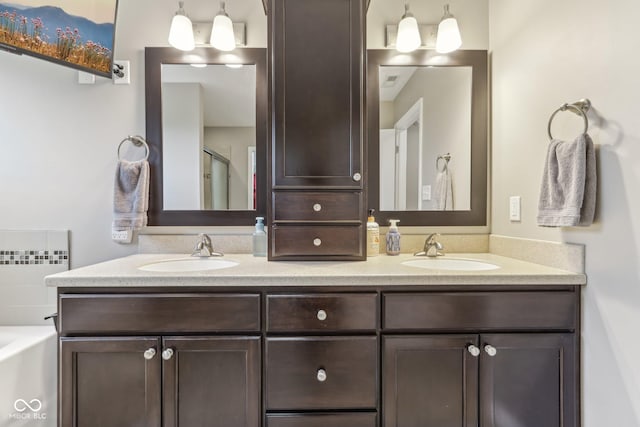11844 Pine Meadow Cir, Fishers, IN 46037 - bathroom with double vanity, a garden tub, and an enclosed shower
