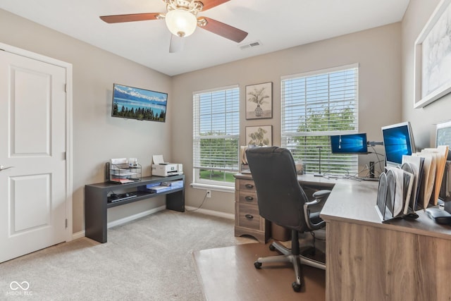 11844 Pine Meadow Cir, Fishers, IN 46037 - home office with baseboards, light carpet, and a ceiling fan