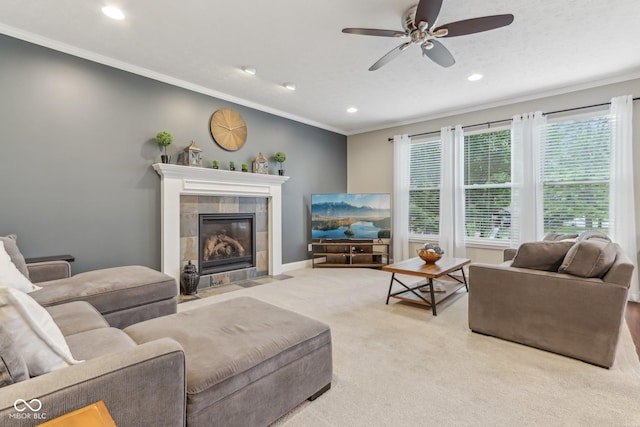 11844 Pine Meadow Cir, Fishers, IN 46037 - living area featuring carpet flooring, a fireplace, recessed lighting, crown molding, and a ceiling fan