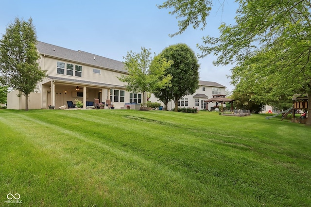 11844 Pine Meadow Cir, Fishers, IN 46037 - back of house featuring a gazebo, a playground, a lawn, and a patio area