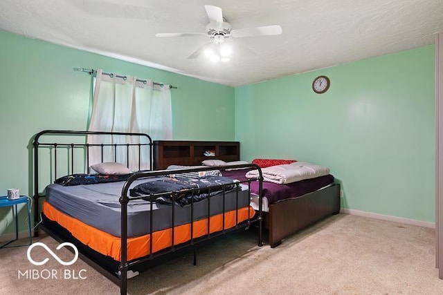 813 Boulder Rd, Indianapolis, IN 46217 - carpeted bedroom with baseboards and a ceiling fan