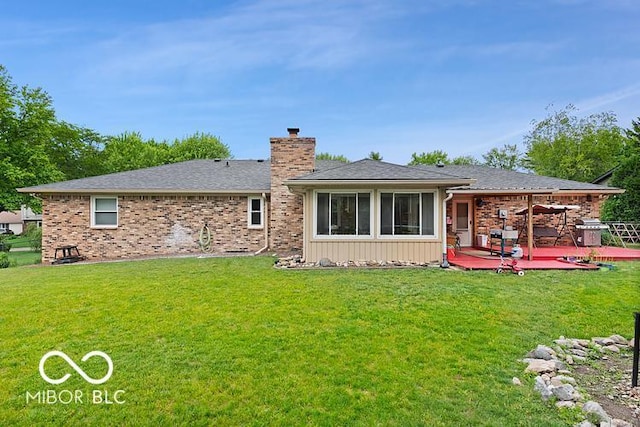 813 Boulder Rd, Indianapolis, IN 46217 - rear view of house featuring a chimney, a wooden deck, and a yard