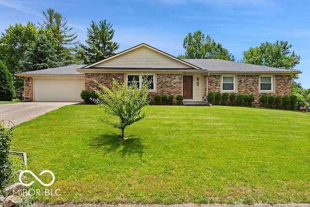 813 Boulder Rd, Indianapolis, IN 46217 - ranch-style house with brick siding, driveway, a garage, and a front lawn