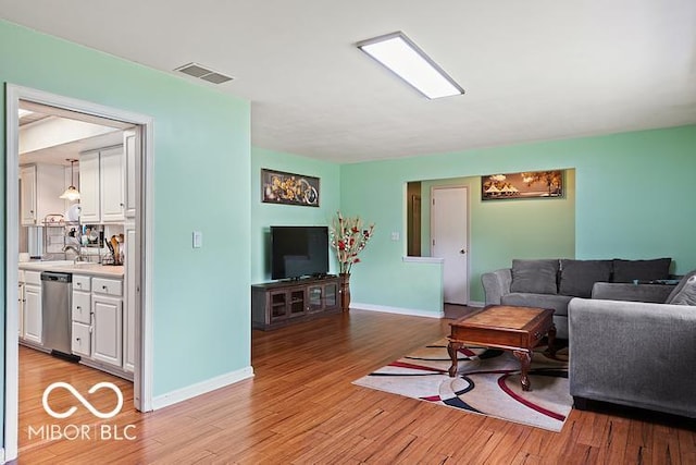 813 Boulder Rd, Indianapolis, IN 46217 - living area featuring light wood finished floors and baseboards