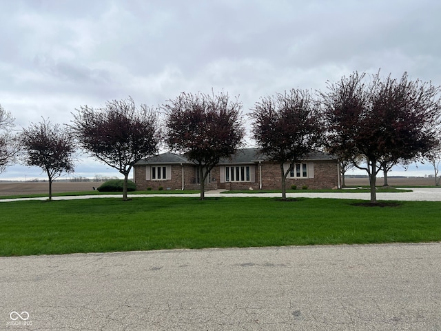 619 W 350 N, Covington, IN 47932 - ranch-style home with a front yard, brick siding, and driveway