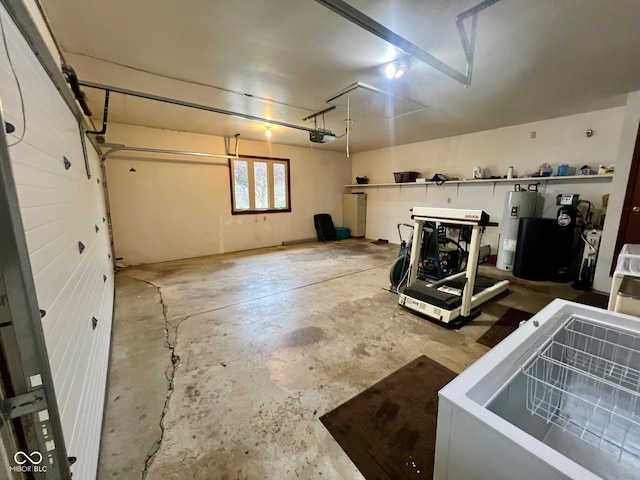 619 W 350 N, Covington, IN 47932 - garage featuring electric water heater and a garage door opener