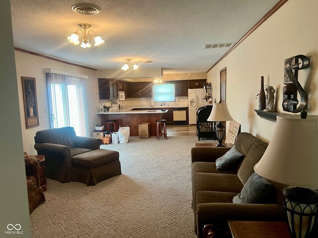 619 W 350 N, Covington, IN 47932 - carpeted living area featuring ornamental molding, a chandelier, a textured ceiling, and a sink