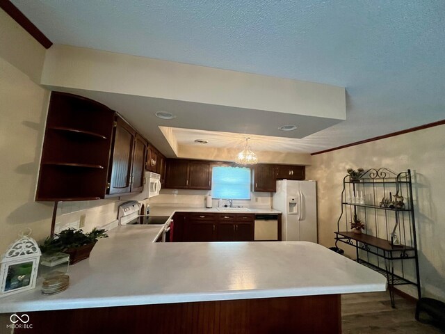 619 W 350 N, Covington, IN 47932 - kitchen featuring white appliances, dark brown cabinets, a sink, dark wood-type flooring, and light countertops