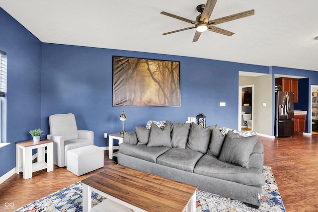 442 Mozart Dr, Greenfield, IN 46140 - living room featuring ceiling fan, dark wood finished floors, and baseboards