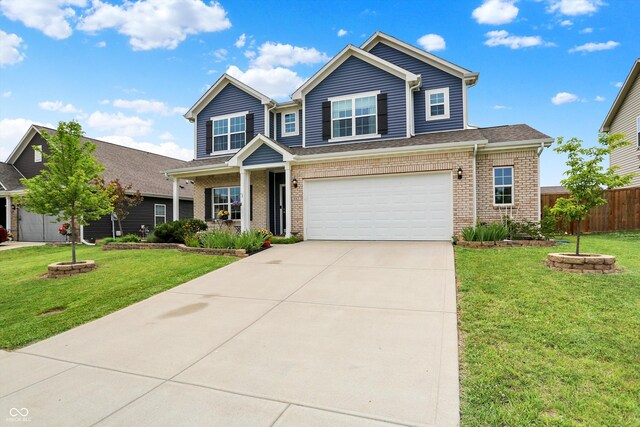 442 Mozart Dr, Greenfield, IN 46140 - view of front of house featuring brick siding, concrete driveway, and a garage