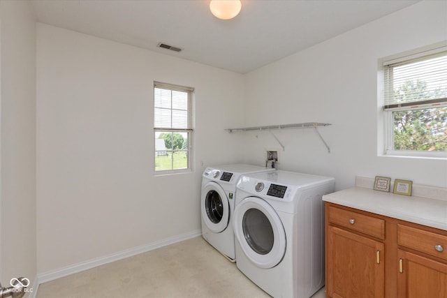163 Clear Branch Dr, Brownsburg, IN 46112 - laundry area with washing machine and clothes dryer, baseboards, cabinet space, and light floors