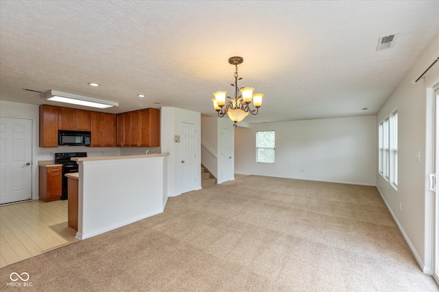 163 Clear Branch Dr, Brownsburg, IN 46112 - kitchen with black microwave, a chandelier, brown cabinetry, electric range oven, and recessed lighting