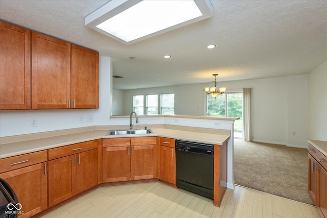 163 Clear Branch Dr, Brownsburg, IN 46112 - kitchen featuring black dishwasher, a sink, a peninsula, brown cabinets, and recessed lighting