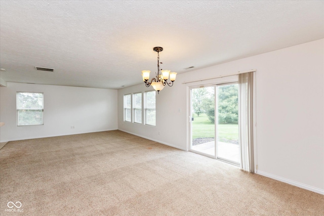 163 Clear Branch Dr, Brownsburg, IN 46112 - spare room with a chandelier, light carpet, baseboards, and a textured ceiling