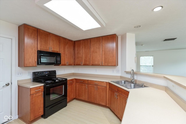163 Clear Branch Dr, Brownsburg, IN 46112 - kitchen with black appliances, a sink, brown cabinetry, light countertops, and recessed lighting