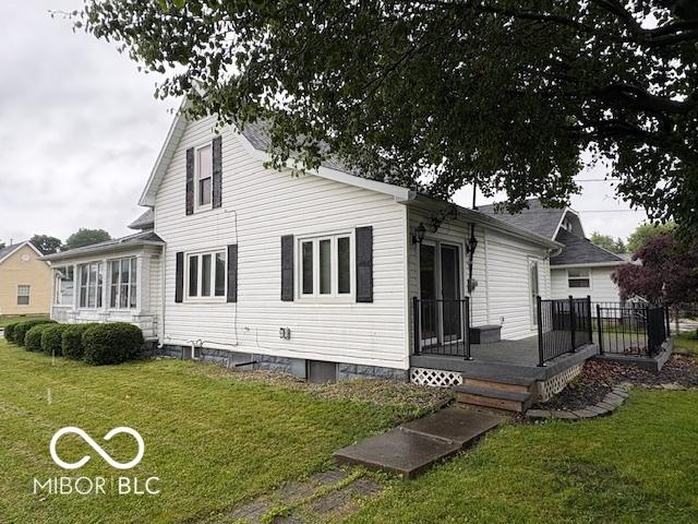 201 N 11th St, Elwood, IN 46036 - rear view of house with a yard and a wooden deck